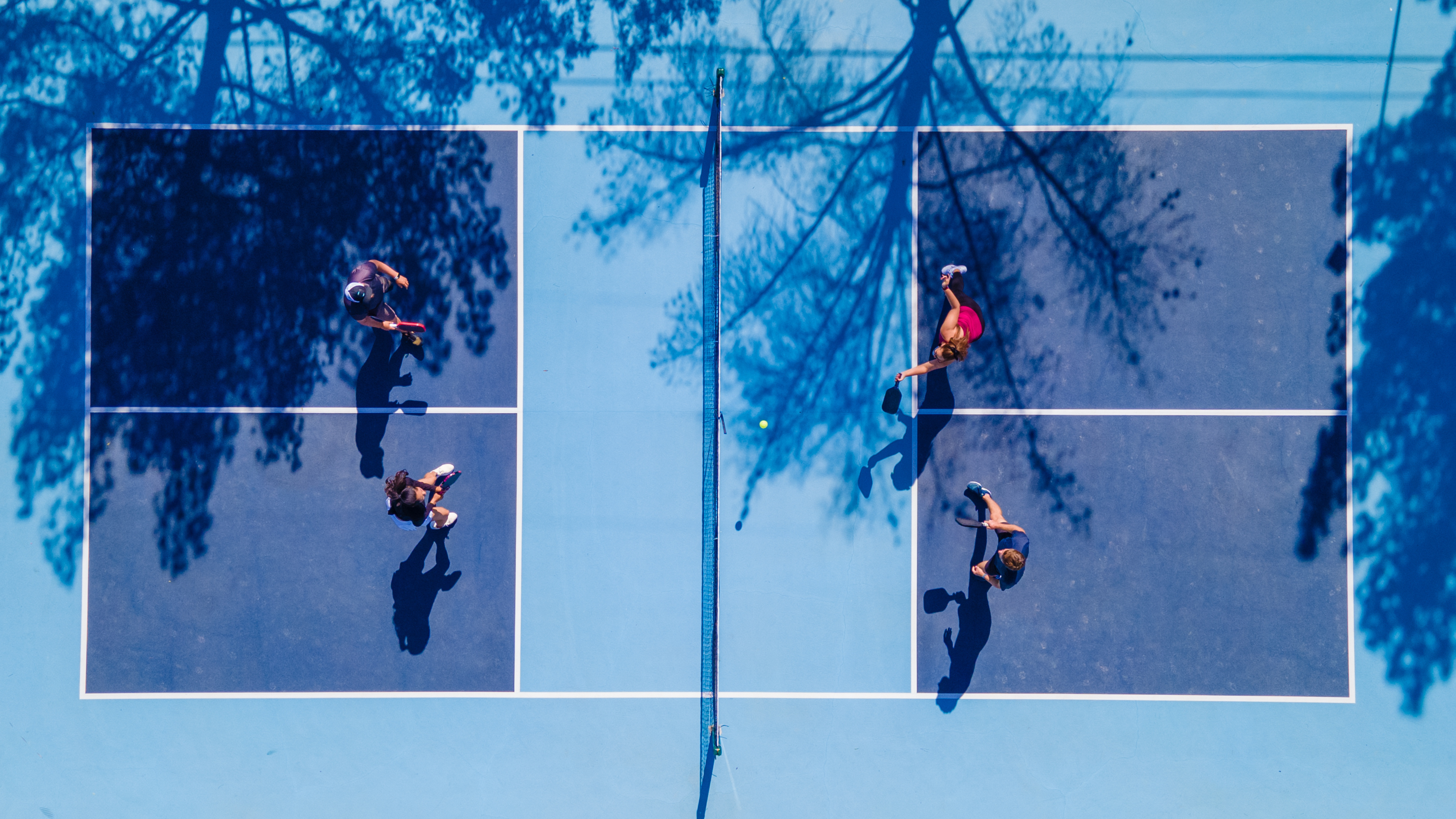 Aerial view of the blue pickleball courts