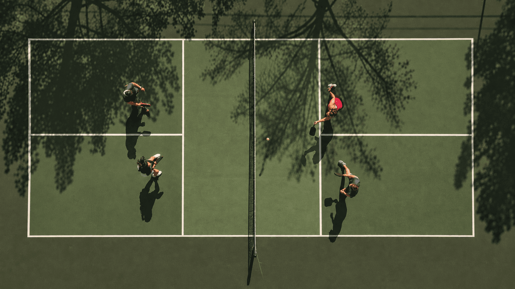 Overhead view of players on the covered courts