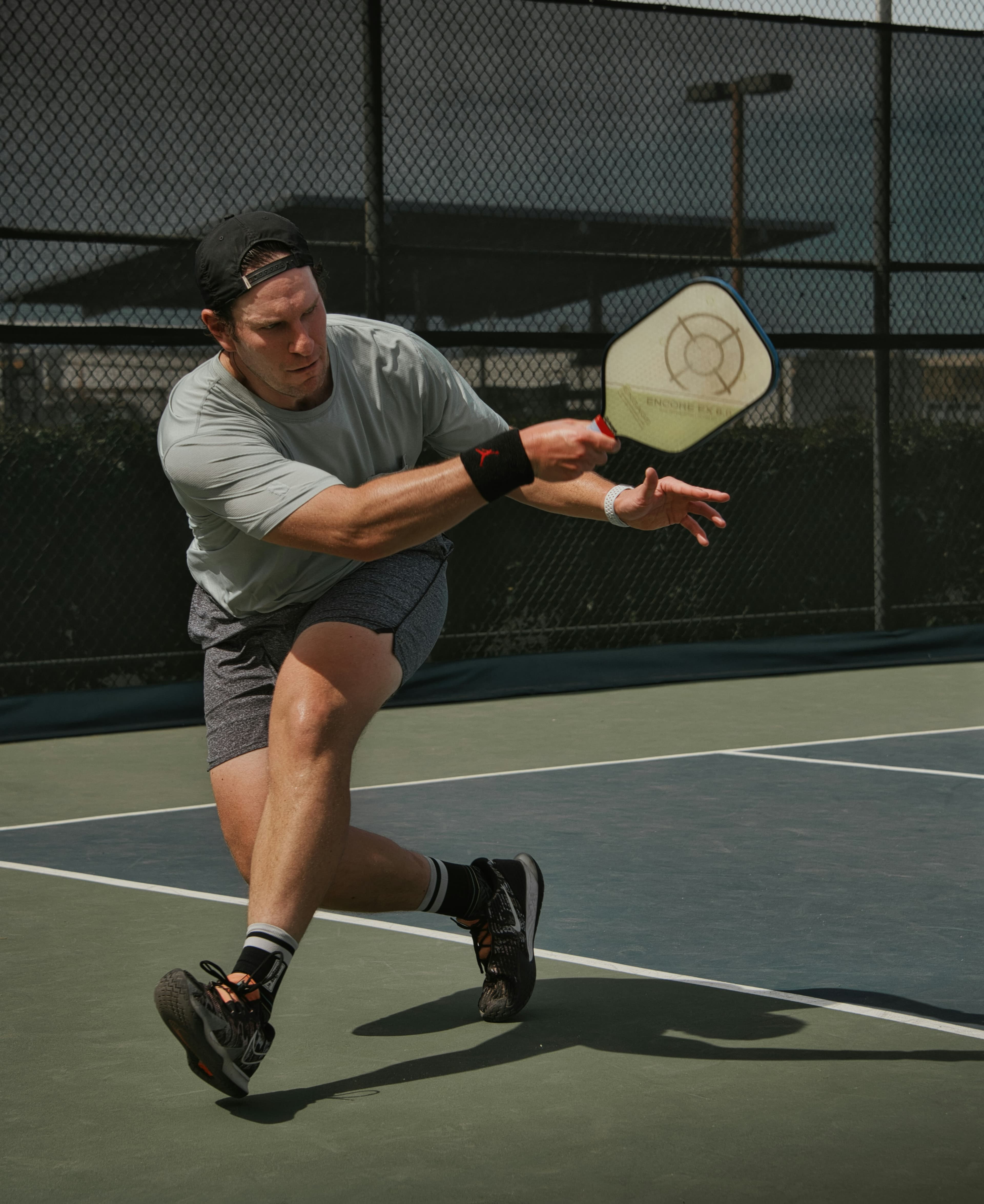 A player reaching for a shot on court