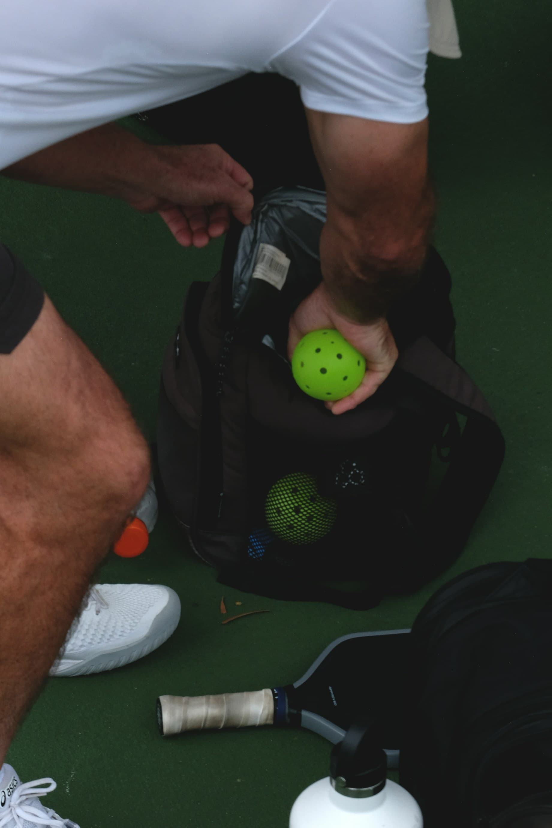 Pickleball ball and equipment on the court